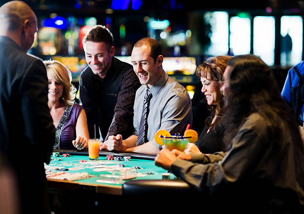 Dragon Hatch live-dealer table with two card positions and live dealer in background